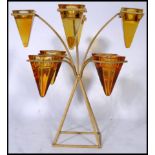 A 20th century candelabra painted metal candle holder having 8 conical glass cups on a splayed