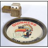 A rare early 20th century Guinness cased set of playing cards. Red and black set also with a