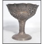 An unusual Chinese silver foil overlaid white metal pedestal bowl. The bowl with foil silver