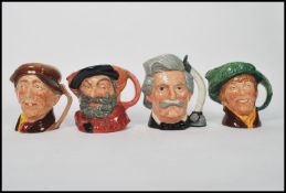 A group of four Royal Doulton Character jugs to include 1949 Falstaff , Mark Twain D6654 , Arriet