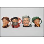 A group of four Royal Doulton Character jugs to include 1949 Falstaff , Mark Twain D6654 , Arriet