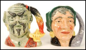 Two Royal Doulton large character jugs The Genie D6892 and The Fortune Teller D6497. Note; from an