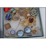 A collection of costume jewellery to include compact , purse , necklaces , bracelets , brooches ,