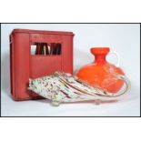 A retro mid century orange glass squat ewer jug vase together with a Murano glass fish and a red
