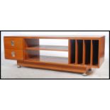 A 1970's teak wood Danish influence low sideboard / side cabinet. Raised on chrome and teak wood