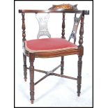 A 20th century Edwardian mahogany inlaid corner chair with upholstered pad seat and cruciform