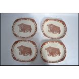 A set of four vintage 20th century retro Beef-eater plates with a brown cow on each. Marks stamped