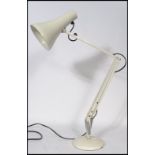 A vintage 20th century retro Herbert Terry 90 anglepoise desk lamp in white with circular base and