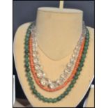 Three vintage 20th century bead necklaces to include a jade example with silver clasp , faceted
