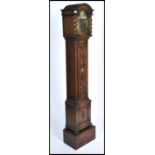 A good quality oak Jacobean revival granddaughter clock having geometric moulded trunk with glass