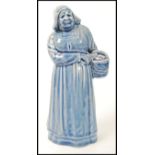 A Royal Doulton stoneware figure, 'Dutch Woman', No. H3. Leslie Harradine, circa 1912. Impressed