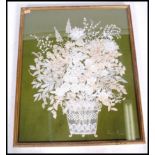 A mid century hand embroidered lace work panel of  chrysanthemums  in basket by Joan Payne being set