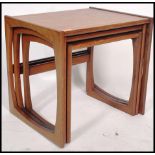 A G-Plan retro teak wood 1970's graduating nest of tables in the Quadrille pattern. The tables