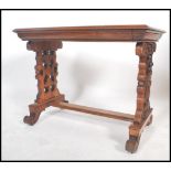 A  good 19th century Victorian walnut writing table desk being raised on pierced column supports