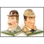 A Royal Doulton Pair Of Bookends Sherlock Holmes D7038 and Dr Watson D7039. Chip to Sherlock.