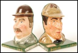 A Royal Doulton Pair Of Bookends Sherlock Holmes D7038 and Dr Watson D7039. Chip to Sherlock.