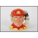 A Royal Doulton double sided character jug depicting Punch and Judy D6946 , handle modelled as a