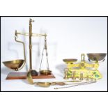 A group of vintage weighing scales and weights to include a set of of miniature bell weights , a