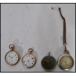 A group of four vintage early 20th century pocket watches to include two gold plates pocket
