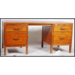 An early to mid 20th century Edwardian War Department oak twin pedestal desk, rectangular top with