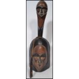 West African Gabonese Vouvi Gong/Bell, the wooden gong carved with heart shaped mask to both body