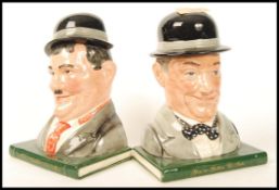 A Royal Doulton Pair Of Bookends Stan Laurel D7119 and Oliver Hardy D7120 Ltd Edt 1070/2500. Note;