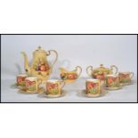 An Aynsley Orchard Rose tea service consisting of tea pot , lidded sugar bowl , creamer milk jug six