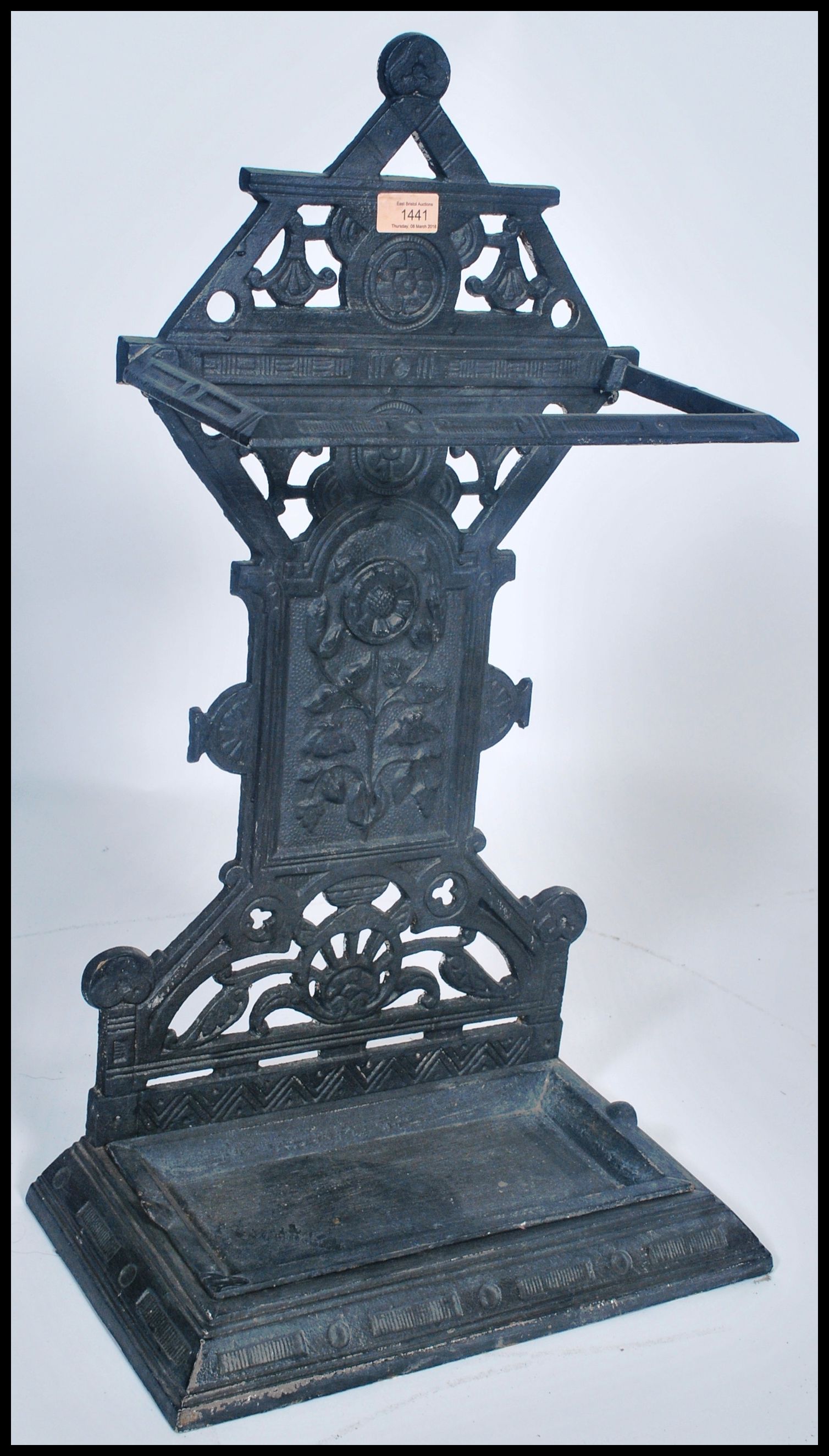 A Victorian cast iron aesthetic movement stick stand. Tray base with upright column back having