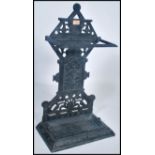 A Victorian cast iron aesthetic movement stick stand. Tray base with upright column back having
