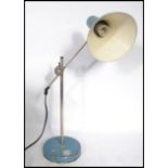 A 1970's Scandinavian vintage industrial teal and chrome desk lamp having a conical two-tone shade