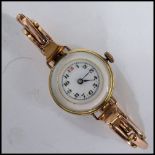 An unusual vintage 20th century yellow metal cocktail watch having a mother of pearl back and