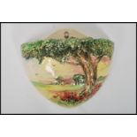 A Royal Doulton cottage scene wall pocket / font D6026 , scene in relief having tree and poppies