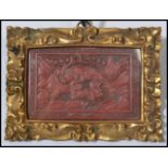 A 19th century Chinese Cinnabar lacquer picture having a Greek key border. The central panel