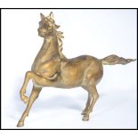 A 20th century cold painted bronze cast figurine of a spirited  Arabian horse, the horse appearing