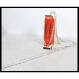 A retro 20th century 1970's orange Hoover / Vacuum