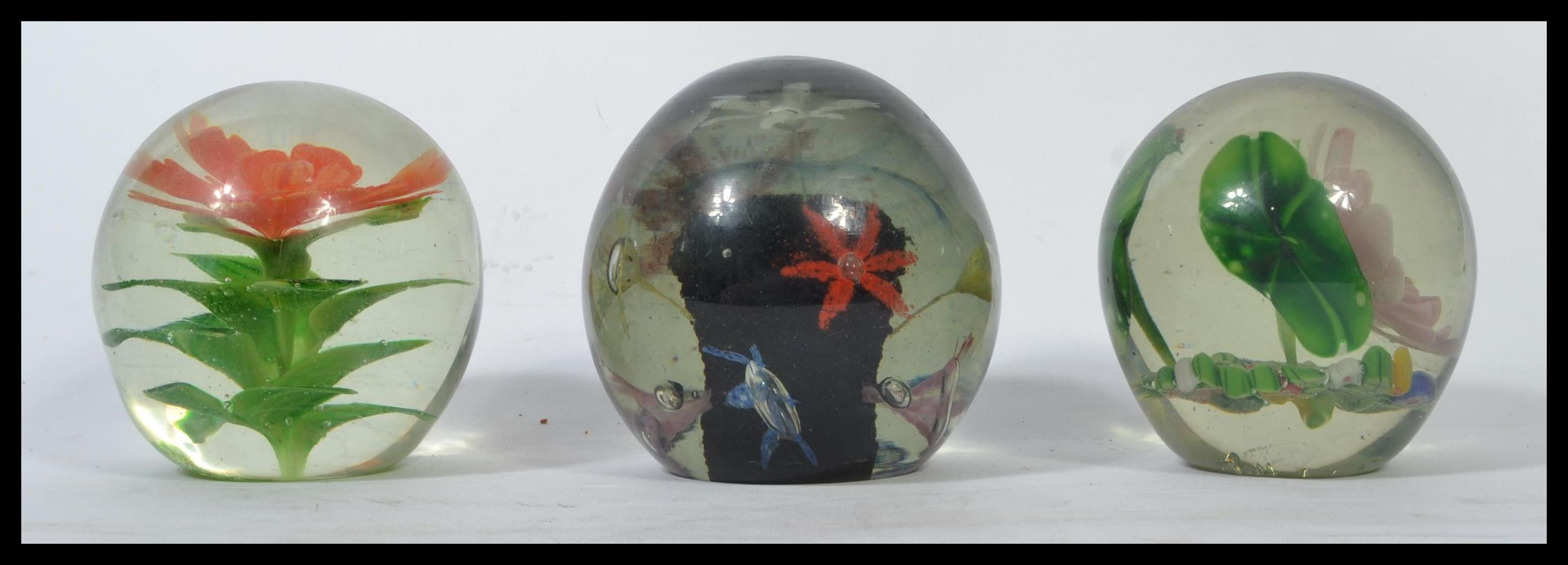 A group of three Nailsea glass 19th century Victorian paperweight glass dumps having inset floral - Image 4 of 6