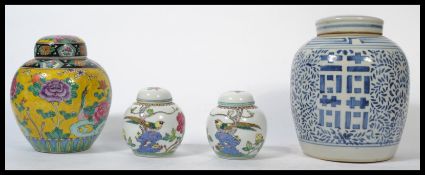 A group of four Oriental ceramic lidded ginger jars dating from the 19th century to include a blue