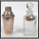 A vintage 20th century Art Deco silver plated cocktail shaker along with a cut glass decanter with a