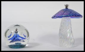 A John Ditchfield Glasform handmade iridescent Toadstool with silver fairy to top. Signed to
