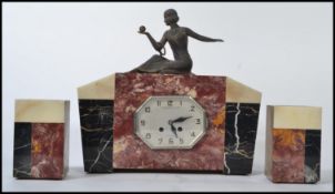 A 1930's Art Deco French 3 piece marble clock garniture. The lozenge shaped silvered dial with