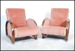 A pair of 1930's  Art Deco 20th century bentwood oak armchairs. Each with bentwood elbow rests