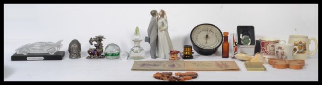 A collection of curios to include a millefiori glass paperweight and perfume bottle, a Lladro figure