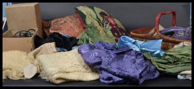 A collection of vintage textiles , cushions , vintage ethnic hats , vintage hair drier and leather