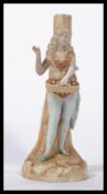 A 19th century Ernst Bohne figural spill vase depicting a maiden against a tree on naturalistic