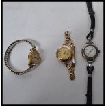 A group of three vintage watches - a sterling silver example with white enamel face and faceted