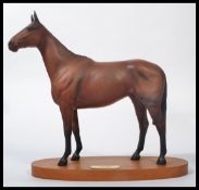 A Royal Doulton figure, 'Arkle', on a plinth, measures 30cm, inc plinth. Appears in good order