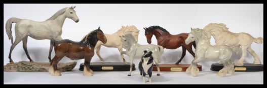 A collection of  Royal Doulton and Beswick ceramic horses as well as a Beswick dog.