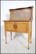 A 19th century satin walnut and marble topped wash stand, rouge marble top over panel doors raised