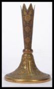 A 19th century French gilt bronze / brass candlestick / vase raised on a circular base with