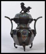 An early to mid 19th century Oriental Chinese Cloisonne incense burner raised on scrolled dragon